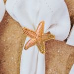 Conjunto-4-Aneis-para-Guardanapos-de-Zinco-Estrela-do-Mar-Dourado-6cm-x-6cm-x-4cm-Wolff
